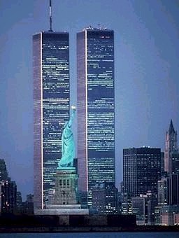 World Trade Center Twin Towers with Statue of Liberty in the foreground.